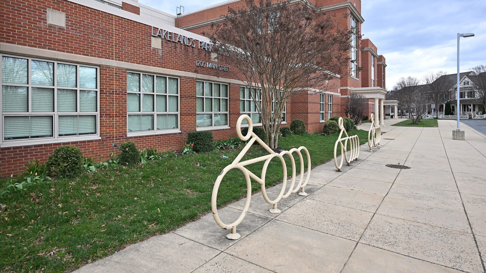 Images of a bike rack in front of a a middle school